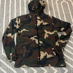 Very lightweight camouflage zip up jacket. Size small.